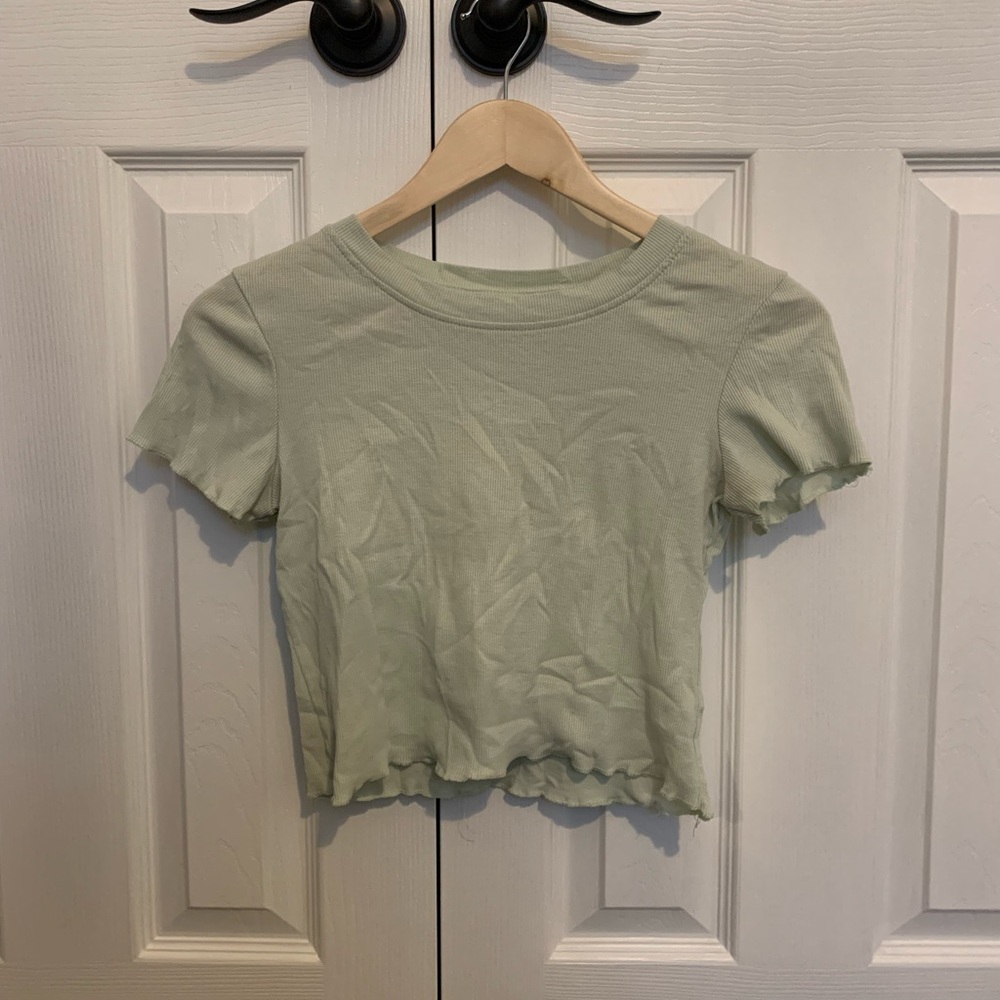 Light green ruffle cut tee shirt